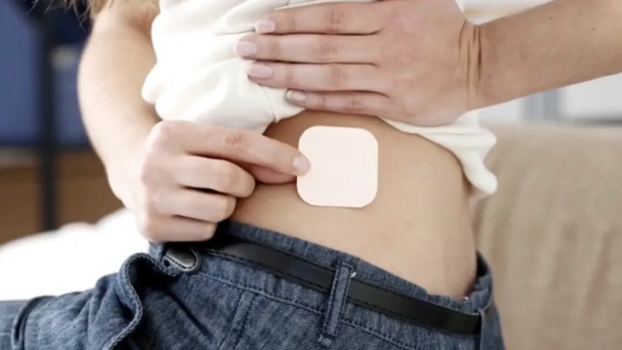 Applying stem cell activation patch at the base of the neck